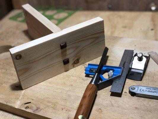 A butt joint that is a part of the Maker's Mob 8-week joinery challenge. The main boards are fir and the pegs are bloodwood.