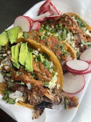 Carnitas, asada, pastor tacos with peanut hot sauce