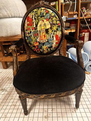 Frida Kahlo in all her splendor! Leather on the seat and touches of black/gold on the wood.