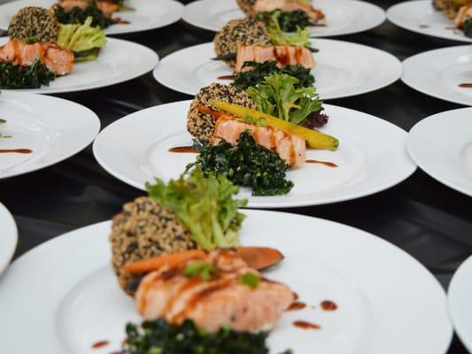 Catered healthy luncheon with grilled salmon and kale salad