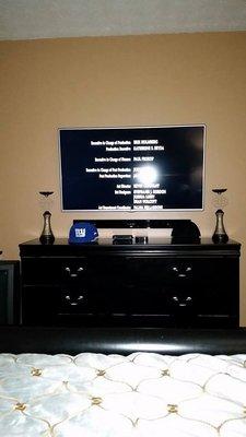 60" LG and sound bar on-wall.