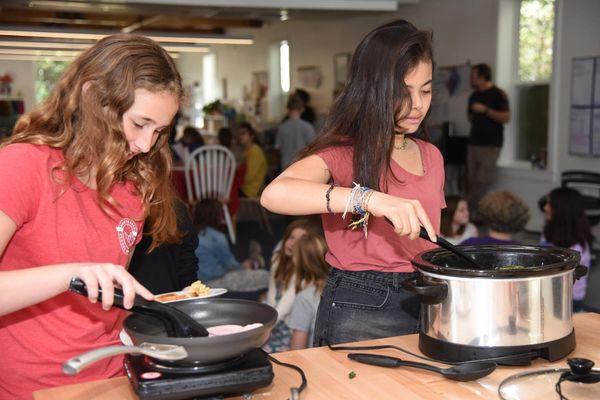 Upper Elementary (9-12) students preparing community lunch