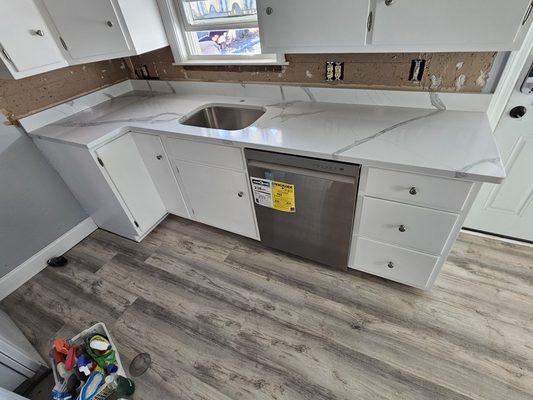 New Quartz countertops and new floors