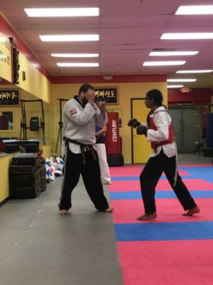 One of our Intermediate students practicing punching technique with Master Ivan.