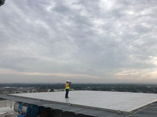 Derek, CEO and Creative Director, capturing a shot on top of LGH for Benchmark Construction.