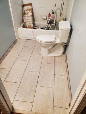 Same tile floor in the bathroom i remodled