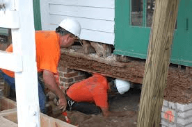 Atlas Construction and Foundation repair crews repair a home