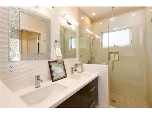 Basic white Quartz top on floating vanity; cutouts and installation by Nella