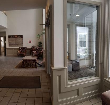 Vestibule and main lobby. Restrooms down hall on left.