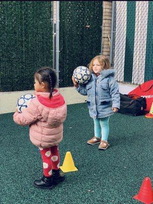 Sienna playing in the playground at daycare