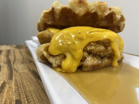 The ATL A List is a Chicken Waffle grilled cheese with Hennessey Maple Syrup