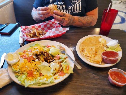 Taco salad, cheese quesadilla, and shredded chicken sandwich