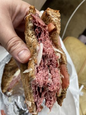 Corned beef and pastrami special - 1/4lb of each meat, Swiss, Mayo, Deli mustard, lettuce, tomato, onion, on Marble Rye...