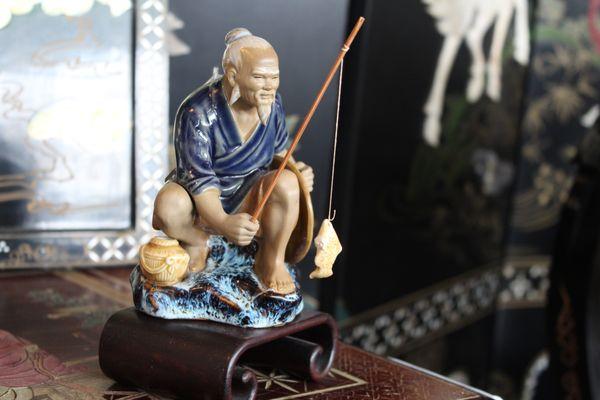 A nice figurine from our Asian corner, a man quietly fishing. To us is a very peaceful image.