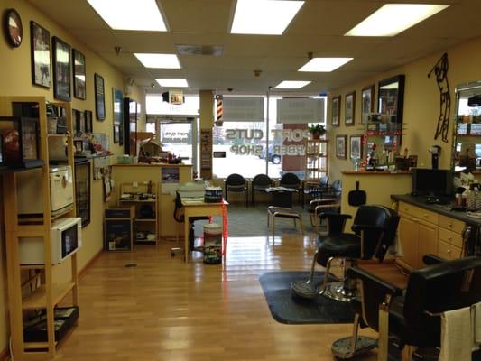 Sports Themed Barbershop. Watch sports while get your haircut.