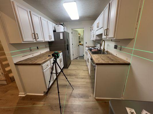 Backsplash peal and stick tile preparation.