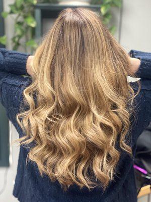 Blonde balayage styled with some beach waves