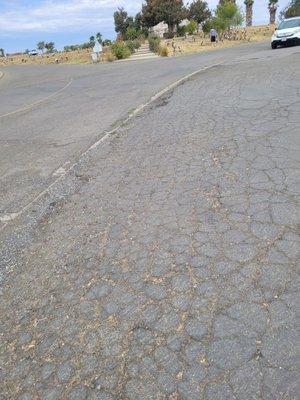 All of the asphalted surface inside the cemetery is in need of repair