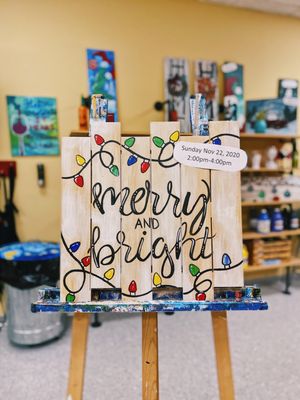 Merry and Bright lights on wooden shiplap.