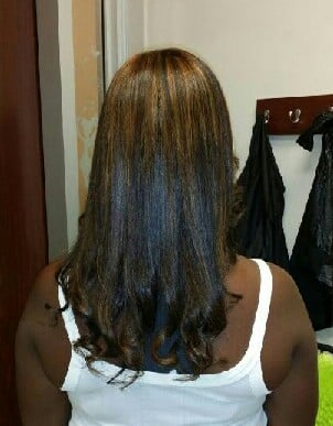 Highlights with extensions. Straightened natural hair.