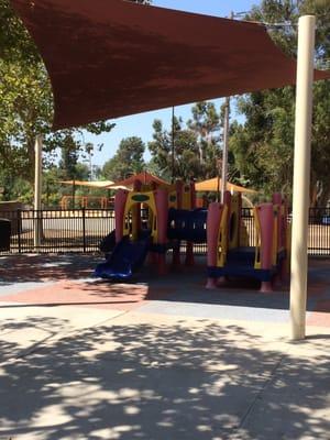 Little littles playground from a distance, covered with shade too!