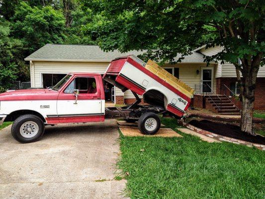 A scoop of compost delivered and dumped...