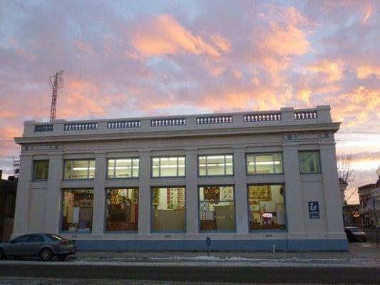 The Sun is awaking over Quilter's Corner Etc.  
 Photo by Kayo Fraser