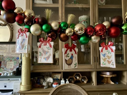 The Lenox Twelve Days of Xmas #1-4 are hanging over the dining table. 12/20/23