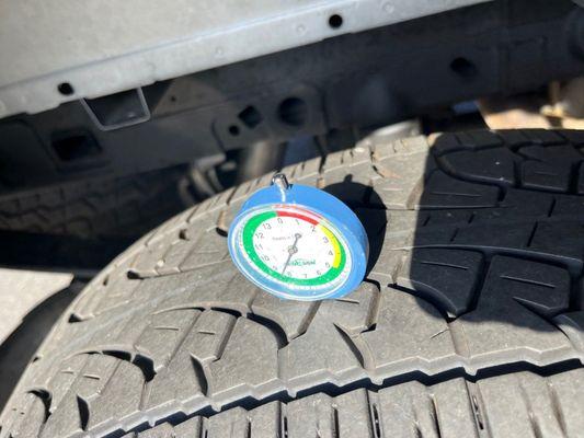 All 4 tires were checked for wear and one was found to be more worn than the other three with cosmetic damage to the corresponding wheel.