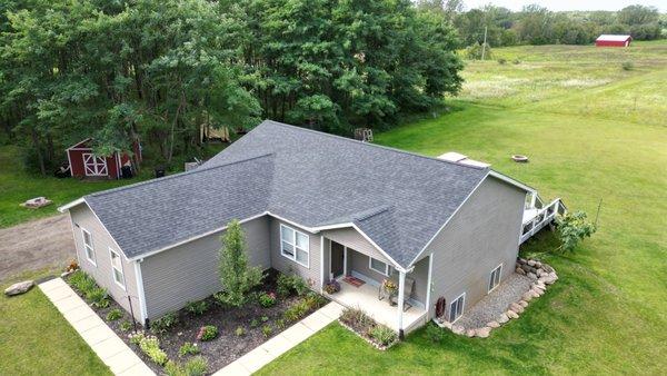 Post-Storm Perfection in Howell, MI. Our team installed this premium roof, transforming vulnerability into strength and style.