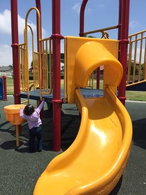 Small slide for toddlers. Soft rubbery floor. No sand.