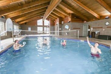 A group of people in a swimming pool playing