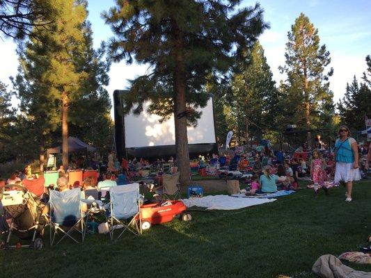 Munch and Movies in the park. Bounce houses. Food. And an inflatable movie screen.