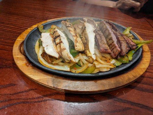 Sizzling Chicken and Steak with Pepper and Onions for Fajitas