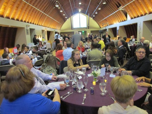 inside the upper hall area of the barn which is a dining reception area with a dance floor