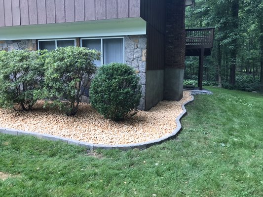 a new project we removed the mulch and replaced it with white gravel and stone edges