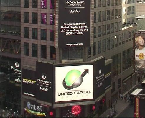 United Capital Source, LLC being congratulated in Times Square NYC for making the Inc. 5000 list of fastest growing companies...