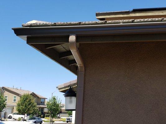 Solid gutter installation. Colors blend perfectly to the house.