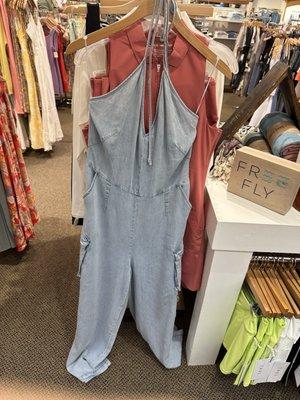 Light wash jean jumpsuit with cute pockets  front view!