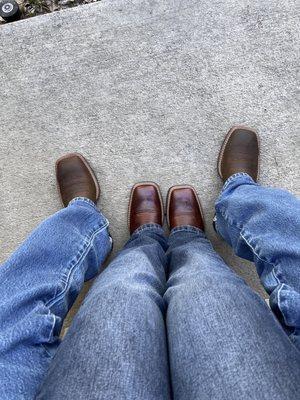 My fiancé and I with Ariat boots