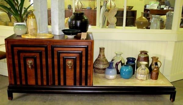 Custom refinished Bert England cabinet/bench w/an assortment of studio pottery