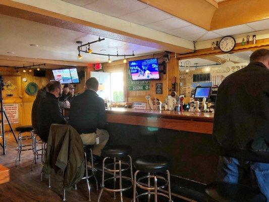 View of the bar. Beer on tap and cans, no bottles. Standard liquor offerings.