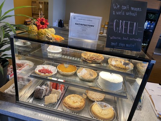 Display case of fresh bakery dessert items.