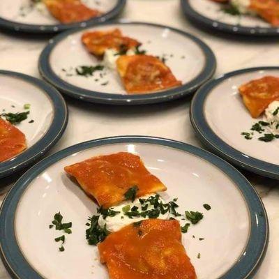 Homemade ravioli filled with slow simmered rabbit ragu.