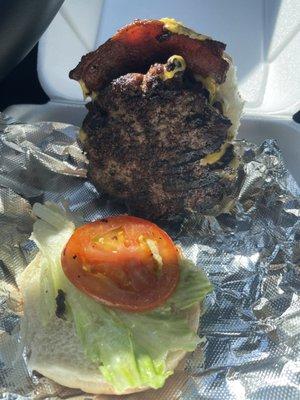 Freshly grilled bacon cheeseburger with fresh veggies and friendly customer service