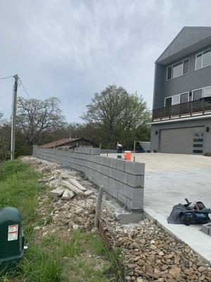 Block retaining wall before veneer and caps were added to finish