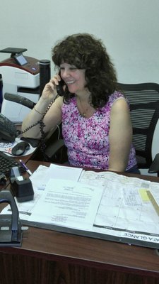 Our office manager Rhonda Oltchick hard at work on the phone