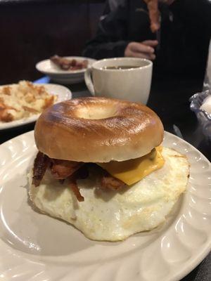 Bacon and eggs over easy sandwich