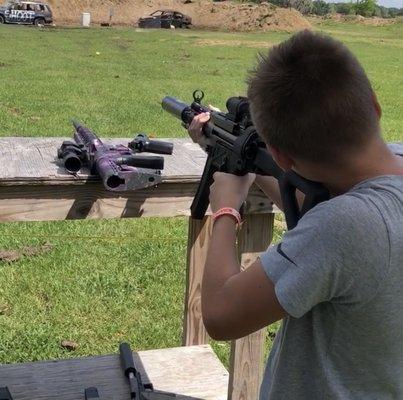 Landon shooting a full auto MP5 suppressed.