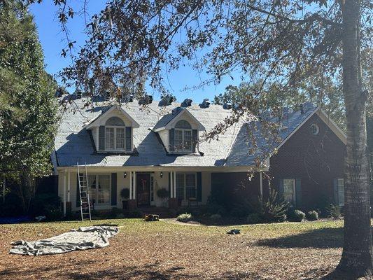 We tore off the old shingles off this nice size home. Put new synthetic moisture barrier down with new 30 year architect shingles